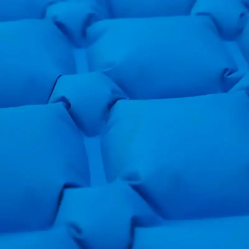 Matelas camping gonflable système pied